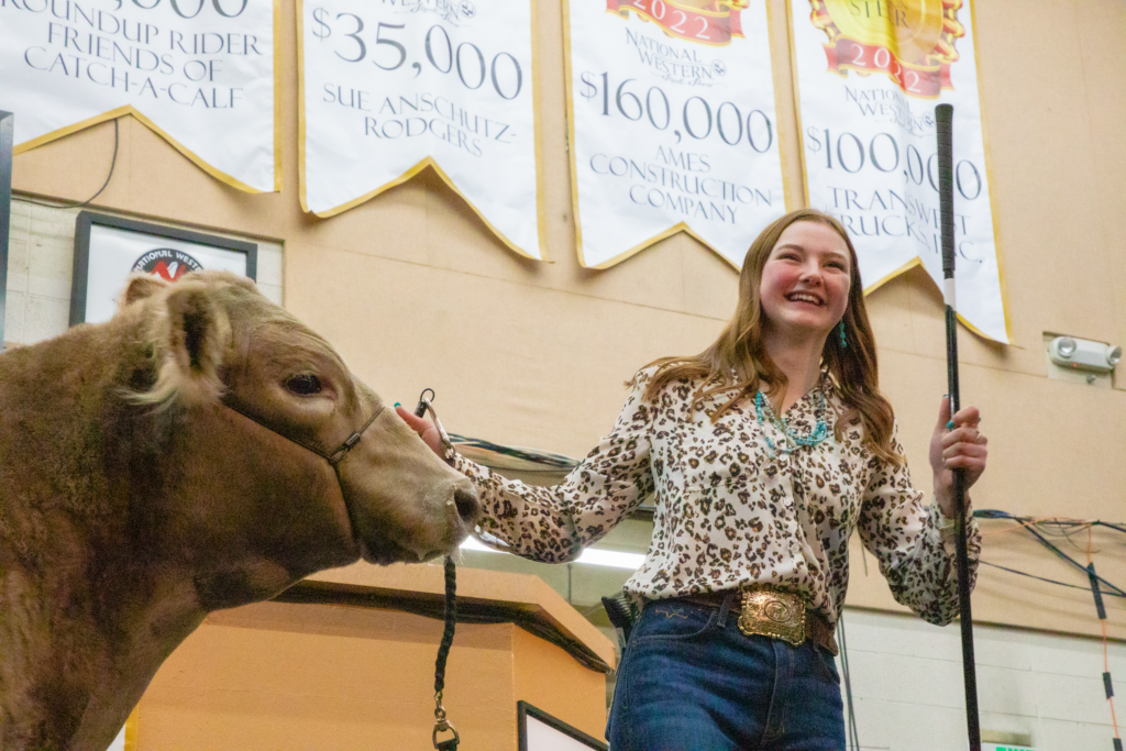 Catch A Calf exhibitor and steer in the Junior Auction